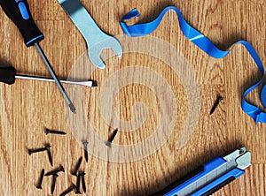 Happy Fathers Day with tools on a rustic wood background.