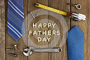 Happy Fathers Day on wood with tools and ties