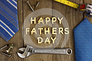 Happy Fathers Day on wood with tools and ties photo