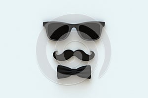 Happy Fatherâ€™s Day concept with mustache and glasses on white background, Top view with copy space