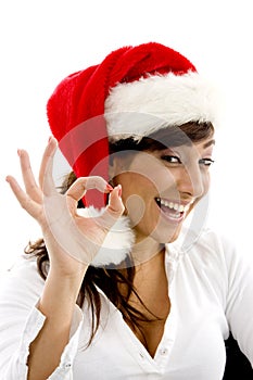 Happy female accountant wearing christmas hat gest