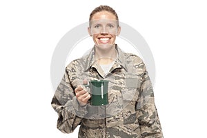 Happy female airman with coffee cup