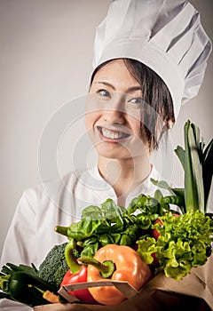 Happy Female Chef with Healthy Farm Vegetables