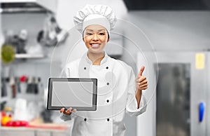 happy female chef with tablet pc showing thumbs up