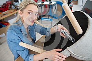 happy female craftsman in workshop