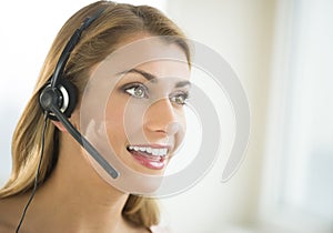 Happy Female Customer Service Representative Looking Away