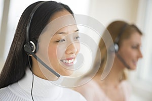 Happy Female Customer Service Representative Looking Away