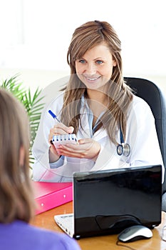 Happy female doctor doing a diagnosis