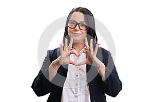 Happy female entrepreneur showing love heart gesture