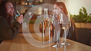 happy female friend company celebrate and drink red and white wine in restaurant