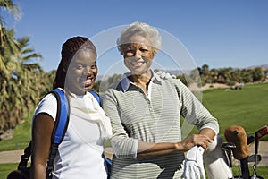 Happy Female Golfers At Golf Course