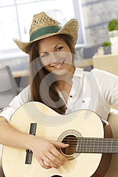 Happy female guitar player