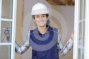 happy female installing window