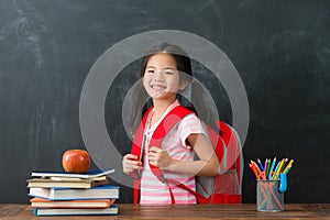 Happy female kid children carrying studying bag