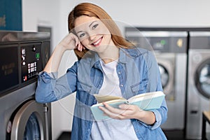 happy female laundress reading