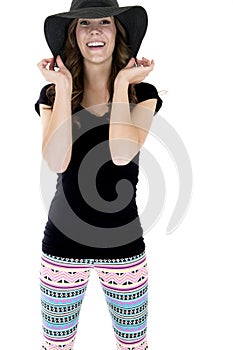 Happy female model wearing trendy leggings and black top