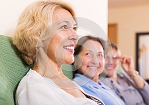 Happy female pensioners at home