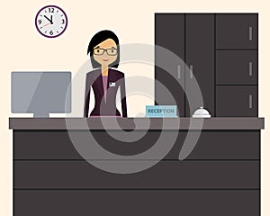 Happy female receptionist standing at hotel