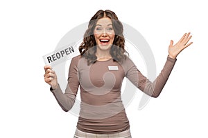 happy female shop assistant with reopen sign
