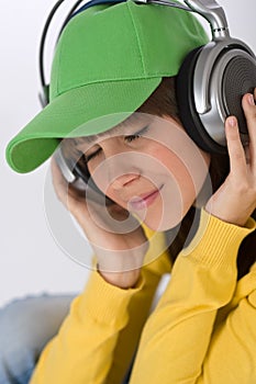 Happy female teenager enjoy music