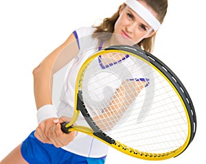 Happy female tennis player in stance
