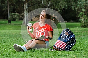 Happy female tourist relaxing in park