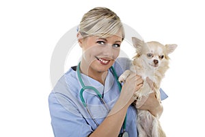 Happy female vet with lap dog