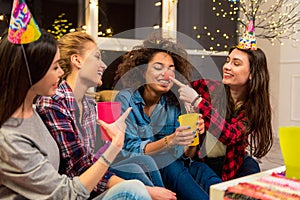 Happy females joking at party