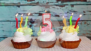 Happy fifth birthday with number five candle on cake, anniversary