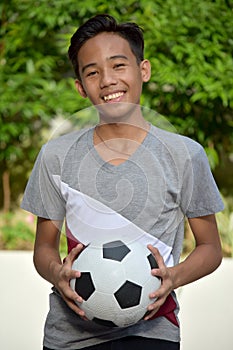 Happy Filipino Person With Soccer Ball