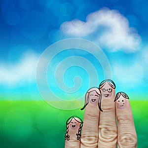 Happy finger family on green nature