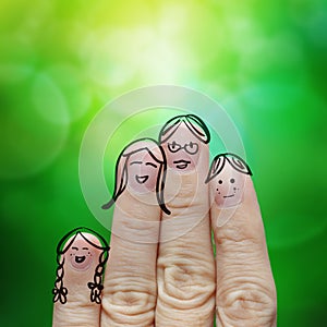 Happy finger family on green nature background