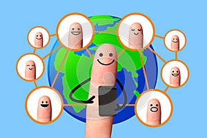 Happy finger using mobile phone with world map, Social network concept.