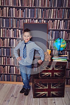 Happy first-grader with a board