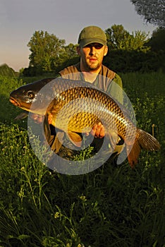 Happy fisherman with his catch