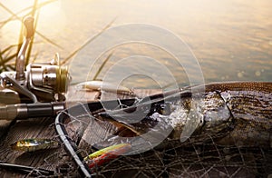 Happy Fishing background; Fishing tackle and trophy Pike