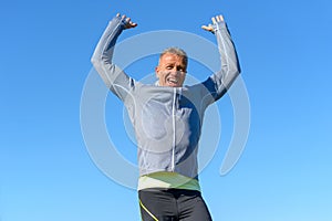 Happy fit man cheering and celebrating