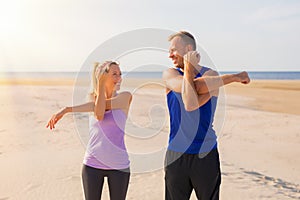 Man and woman stretching before workout