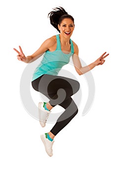 Happy fit and slim woman dancing and jumping isolated over white