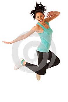 Happy fit and slim woman dancing and jumping isolated over white