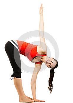 Happy fit woman doing a yoga stretch