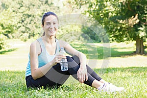 Happy fitness girl relaxing after exercising