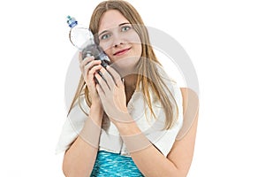 Happy fitness woman with a cold bottle of water