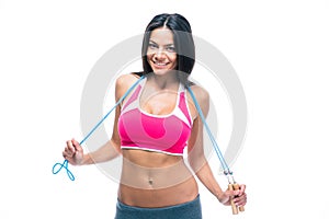 Happy fitness woman holding skipping rope