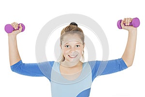 Happy fitness young girl lifting dumbbells smiling cheerful, fresh and energetic