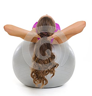 Happy fitness young woman doing abdominal crunch