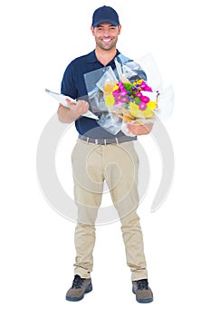 Happy flower delivery man holding clipboard