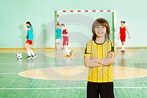 Happy football captain in gym during training