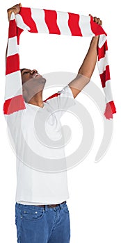 Happy football fan waving scarf