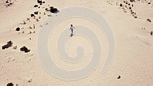 Happy free caucasian woman lay down on the sand at the beach enjoying the summer holiday vacation - travel and wanderlust concept